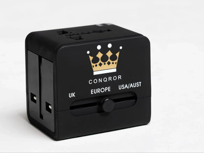 Black travel adapter with UK, European, and USA/Australia plug options - Chargimundo