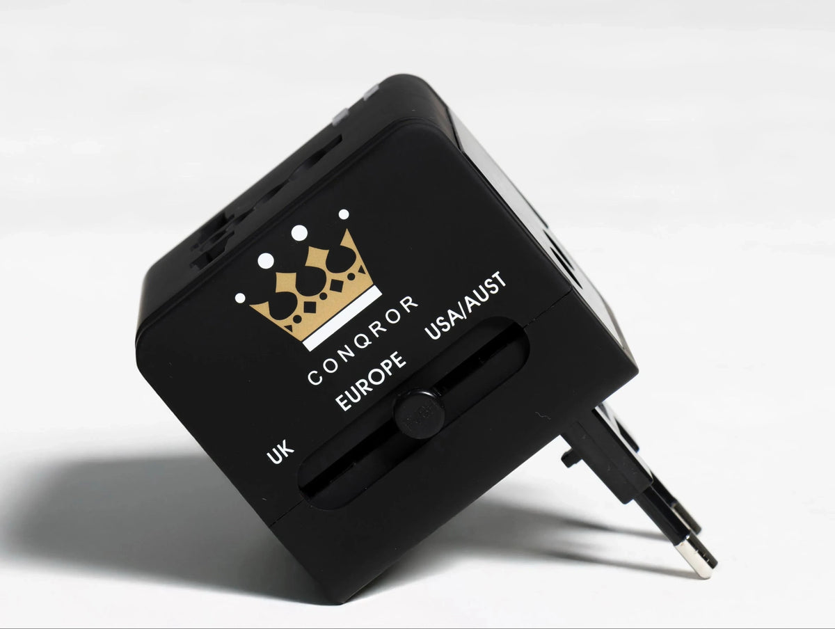 Travel adapter showing various socket configurations and USB ports - Chargimundo