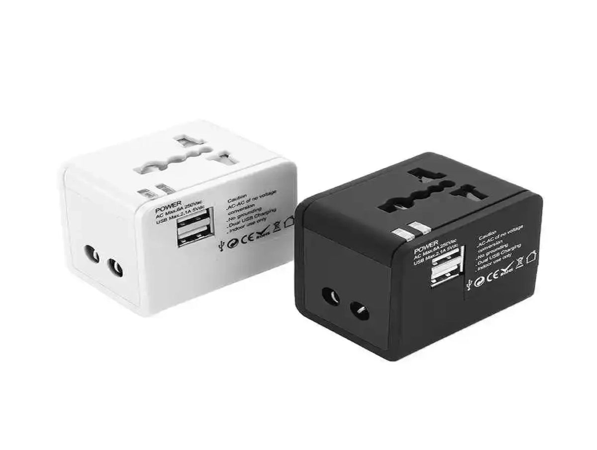 Compact travel adapter with dual USB ports for charging - Chargimundo