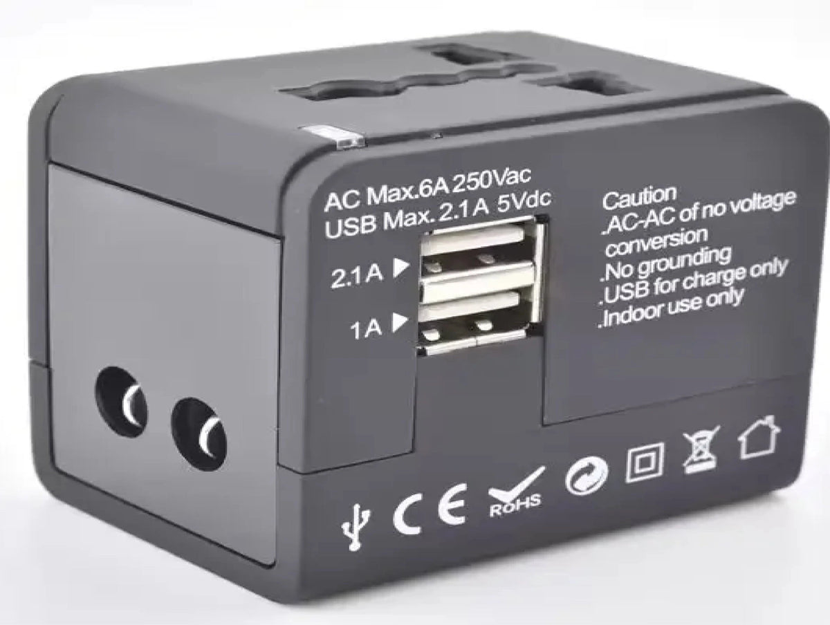 Black and white universal travel adapters with USB support - Chargimundo